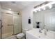 Bathroom with a glass shower, toilet, sink and large mirror at 2637 Morningside Nw Trl, Kennesaw, GA 30144