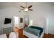 Spacious bedroom with ample lighting, a television, and an ensuite bathroom at 2637 Morningside Nw Trl, Kennesaw, GA 30144