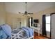 Cozy bedroom with desk, built-in shelving, and a ceiling fan at 2637 Morningside Nw Trl, Kennesaw, GA 30144
