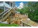 Multi-level wooden deck with stairs, and retaining wall at 2637 Morningside Nw Trl, Kennesaw, GA 30144