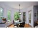 Charming dining area with hardwood floors and a window view overlooking the greenery at 2637 Morningside Nw Trl, Kennesaw, GA 30144