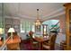 Dining room with chandelier, table with seating for six, and views of the staircase and front entrance at 2637 Morningside Nw Trl, Kennesaw, GA 30144