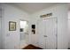 Hallway with pantry and laundry room access, offering convenient storage and utility space at 2637 Morningside Nw Trl, Kennesaw, GA 30144