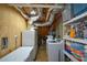 Laundry room featuring washer, dryer, and shelving for storage at 2637 Morningside Nw Trl, Kennesaw, GA 30144