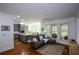 Open-concept living room with a kitchen, a dining space, and natural light at 2637 Morningside Nw Trl, Kennesaw, GA 30144