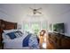 Spacious main bedroom with tray ceiling, hardwood floors, and large windows offering natural light at 2637 Morningside Nw Trl, Kennesaw, GA 30144