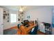 Bright office space with built-in shelves, desk, and cozy seating area at 2637 Morningside Nw Trl, Kennesaw, GA 30144