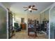 Inviting office space with tile floors, a ceiling fan, built-in shelving and plenty of room for working at 2637 Morningside Nw Trl, Kennesaw, GA 30144