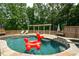 Inground pool with tanning ledge and fun floaty at 2637 Morningside Nw Trl, Kennesaw, GA 30144