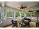 Screened in porch with wood flooring, patio furniture, heater and ceiling fans for year-round comfort at 2637 Morningside Nw Trl, Kennesaw, GA 30144