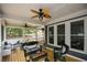 Stylish screened-in porch with ceiling fans, heaters, modern furniture and a view of the backyard at 2637 Morningside Nw Trl, Kennesaw, GA 30144