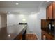 Wet bar with sink, granite countertop, cabinets and a beverage cooler area at 2637 Morningside Nw Trl, Kennesaw, GA 30144