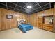 Bedroom with wood paneled walls and a nautical themed headboard and dark coffered ceiling at 286 Hilton Way Way, Canton, GA 30114