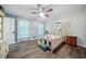 Bright bedroom with ceiling fan and light colored walls at 286 Hilton Way Way, Canton, GA 30114