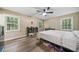 Bright bedroom with three windows, neutral walls and hardwood floors at 286 Hilton Way Way, Canton, GA 30114