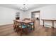Charming dining room with chandelier, hardwood floors, and a view to the living room at 286 Hilton Way Way, Canton, GA 30114