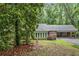 Charming single story home with a brick facade, covered parking, and lush landscaping at 286 Hilton Way Way, Canton, GA 30114