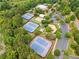 Scenic aerial view of community tennis courts, playground, parking area, and clubhouse with pool at 3743 Lake Edge Dr, Suwanee, GA 30024