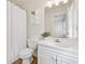 Well-lit bathroom featuring a shower-tub combination and updated vanity with storage at 3743 Lake Edge Dr, Suwanee, GA 30024