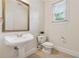 Half bathroom with pedestal sink at 3743 Lake Edge Dr, Suwanee, GA 30024