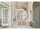 Grand foyer with wood staircase at 3743 Lake Edge Dr, Suwanee, GA 30024