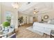 Spacious main bedroom with tray ceilings, fan, natural light and wood floors at 3743 Lake Edge Dr, Suwanee, GA 30024