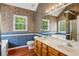 Primary bathroom boasts a double vanity, soaking tub, and walk-in shower at 605 Pebble Blvd, Covington, GA 30016