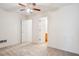 Comfortable bedroom with a ceiling fan and doors to other rooms, providing privacy and convenience at 605 Pebble Blvd, Covington, GA 30016