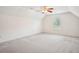 Spacious bonus room with neutral carpet, vaulted ceilings, and a window, ideal for flexible living or recreation space at 605 Pebble Blvd, Covington, GA 30016