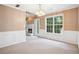 Formal dining room features large windows and a fireplace at 605 Pebble Blvd, Covington, GA 30016