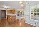 Bright kitchen featuring a view of the living room, ample counter space, and exterior windows at 605 Pebble Blvd, Covington, GA 30016