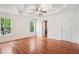 Spacious main bedroom boasts a trey ceiling and hard wood floors at 605 Pebble Blvd, Covington, GA 30016