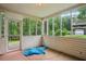 Enclosed porch with views of backyard and foliage at 605 Pebble Blvd, Covington, GA 30016