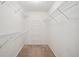 Walk-in closet features built-in shelving at 605 Pebble Blvd, Covington, GA 30016
