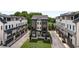 Aerial view showcasing modern townhomes with manicured lawns and well-designed facades offering an inviting neighborhood at 2347 Hosea L Williams Ne Dr # 11, Atlanta, GA 30317