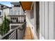 Side view of a balcony with wood flooring and black metal railing with exterior views at 2347 Hosea L Williams Ne Dr # 11, Atlanta, GA 30317