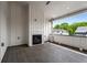 Inviting balcony featuring a cozy fireplace and a charming view of lush green trees at 2347 Hosea L Williams Ne Dr # 11, Atlanta, GA 30317