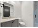 Chic bathroom featuring modern fixtures, a gray vanity, and a walk-in shower at 2347 Hosea L Williams Ne Dr # 11, Atlanta, GA 30317