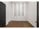 Well-lit bedroom featuring neutral walls, hardwood floors, and large windows at 2347 Hosea L Williams Ne Dr # 11, Atlanta, GA 30317