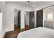 Bright bedroom features a walk-in closet, bathroom, and beautiful dark hardwood flooring at 2347 Hosea L Williams Ne Dr # 11, Atlanta, GA 30317