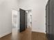 Hallway shot showcasing the home's hardwood floors, neutral walls, and modern doors at 2347 Hosea L Williams Ne Dr # 11, Atlanta, GA 30317