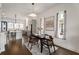 Dining area flows into a modern kitchen with gray cabinets, a center island, and stainless appliances at 2347 Hosea L Williams Ne Dr # 11, Atlanta, GA 30317