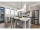 Stylish kitchen featuring stainless steel appliances, a large island, and modern fixtures at 2347 Hosea L Williams Ne Dr # 11, Atlanta, GA 30317