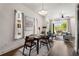 Open-concept space with dining area flows seamlessly from a sunny living room with a balcony at 2347 Hosea L Williams Ne Dr # 11, Atlanta, GA 30317