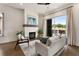 Charming living room offers a fireplace, natural light, and balcony access with outdoor views at 2347 Hosea L Williams Ne Dr # 11, Atlanta, GA 30317