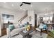 Spacious living area connects seamlessly with modern decor, a staircase, and a dining space at 2347 Hosea L Williams Ne Dr # 11, Atlanta, GA 30317