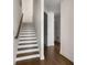Bright entryway reveals an open staircase with wood accents and hardwood floors at 2347 Hosea L Williams Ne Dr # 11, Atlanta, GA 30317