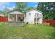 Large backyard featuring a deck, patio, and well-maintained lawn at 3012 Dempsey Pl, Lawrenceville, GA 30044
