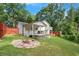 Spacious backyard with a fire pit and deck, perfect for outdoor gatherings at 3012 Dempsey Pl, Lawrenceville, GA 30044