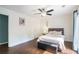 Bright bedroom with hardwood floors and french doors leading to private balcony at 3012 Dempsey Pl, Lawrenceville, GA 30044